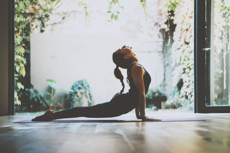woman practicing yoga indoor
