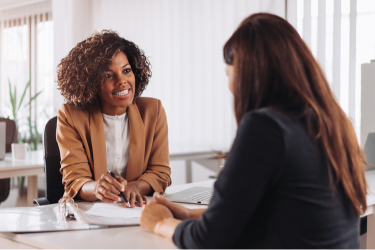 Woman consulting with a female financial manager at the bank