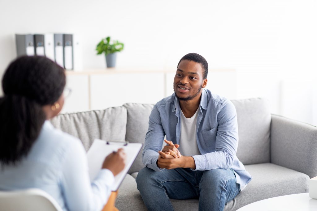 Black man talking to a black therapist 