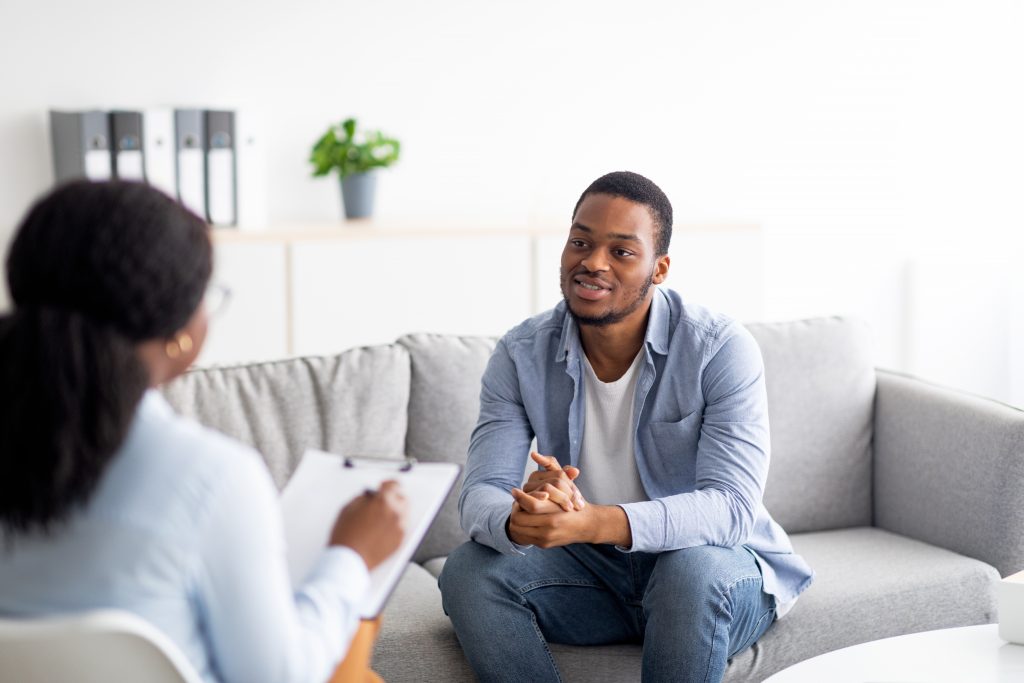 Black man talking to a black therapist