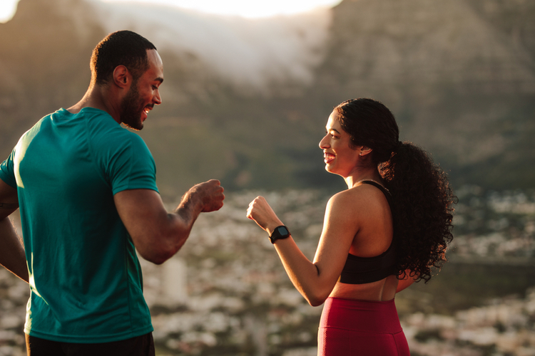 Fitness couple giving fist bump after the workout.