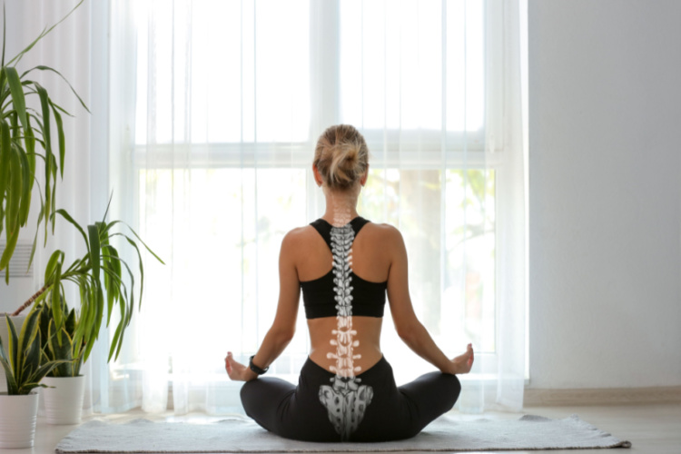 Young woman with good posture meditating at home, back view