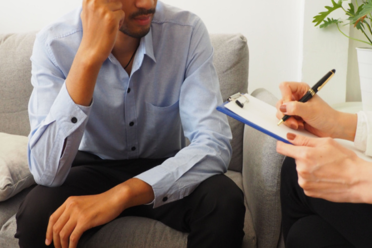 Man seeking advice from professional female