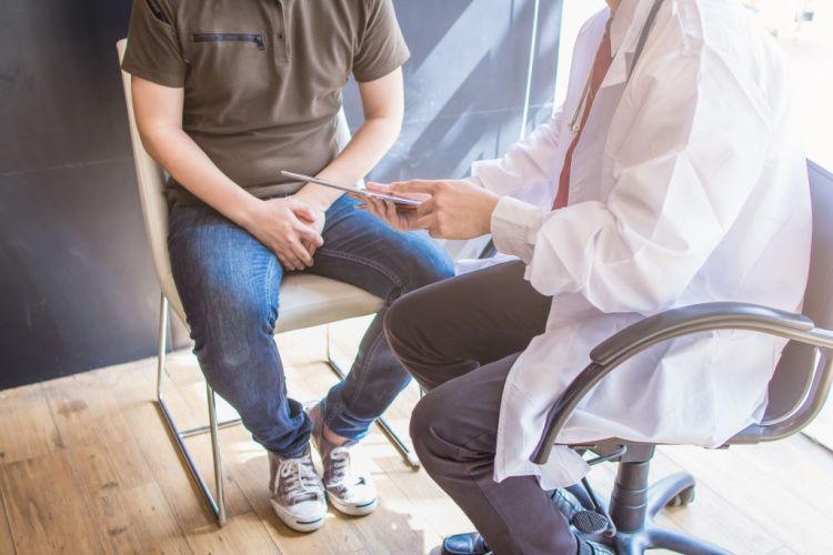 doctor is giving advice on health care and consulting about the detected prostate cancer.