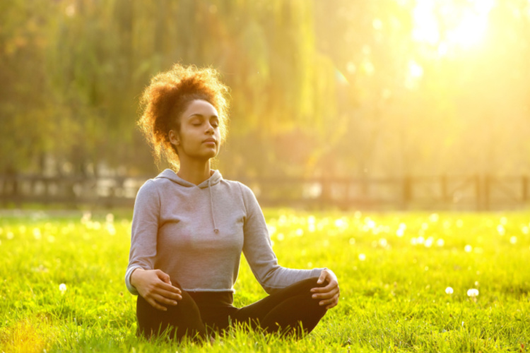woman meditating in nature