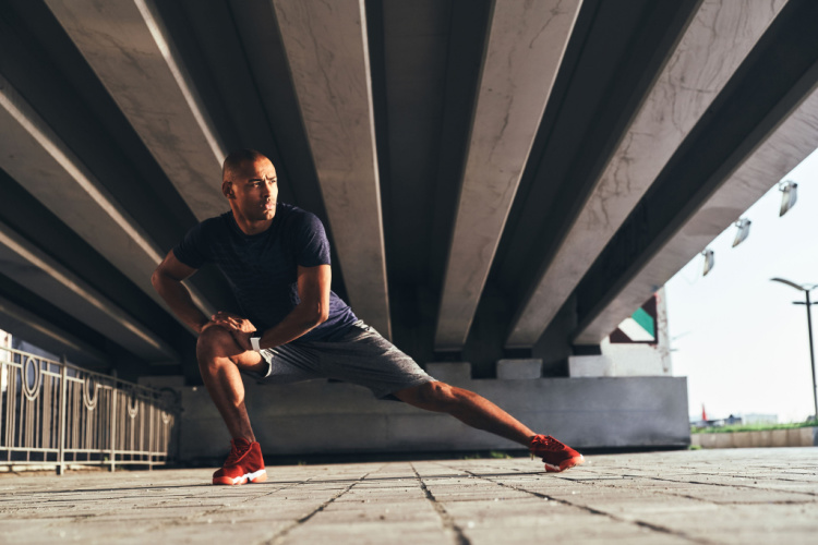 stretching while warming up outdoors