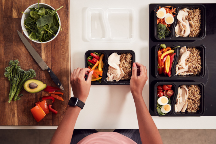 Preparing Batch Of Healthy Meals At Home In Kitchen