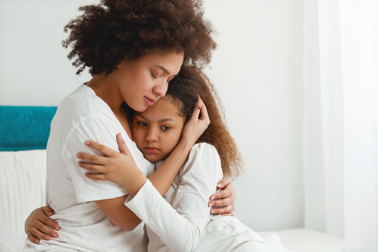 Mother comforting her daughter